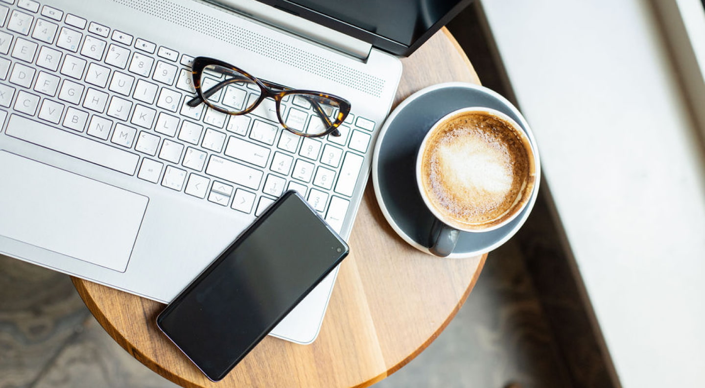 Workspace with laptop and coffee
